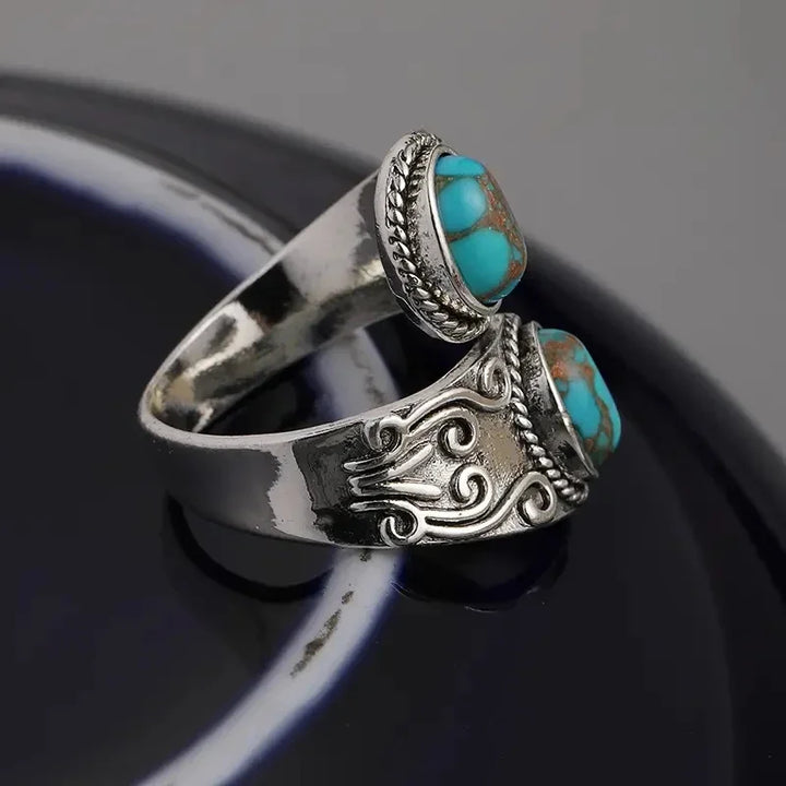 Eleganter Vintage Ring mit Türkis im Kreuzband